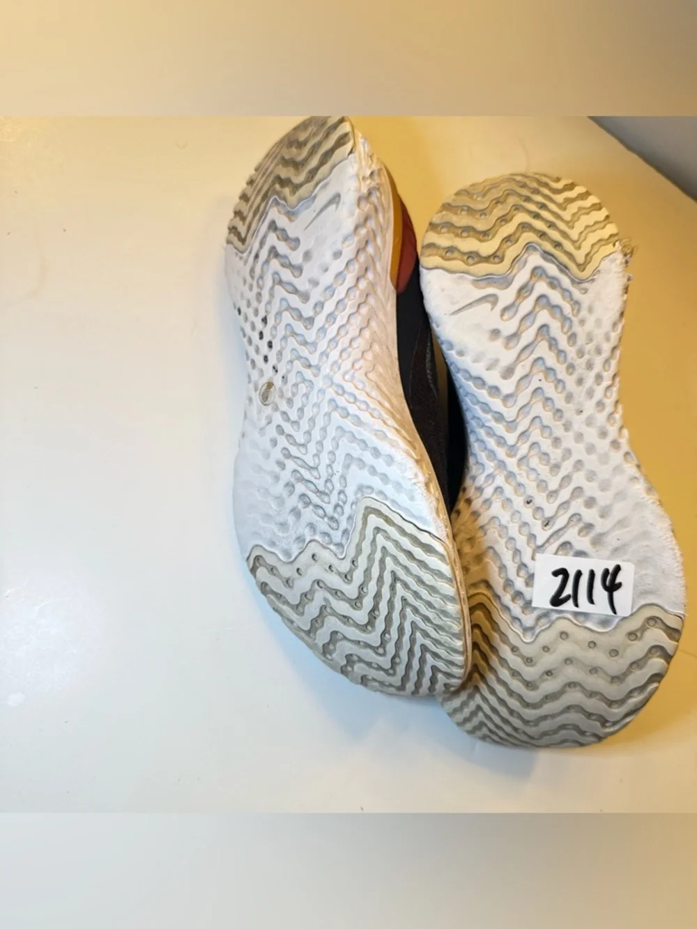 Nike Black Slip-On Athletic Shoes with Orange Heel Accent